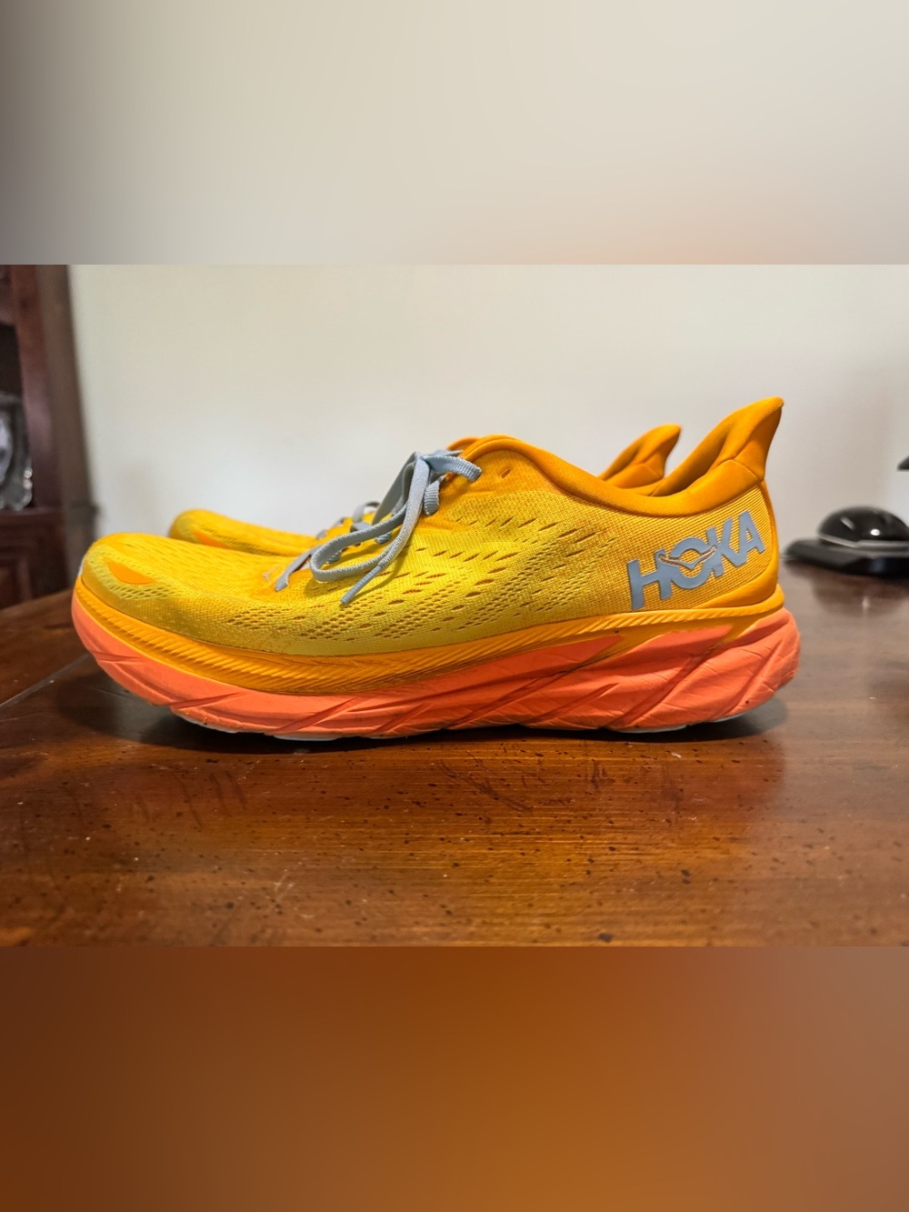 Hoka Yellow and Orange Running Shoes with Gray Laces